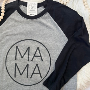 Gray and black baseball shirt with 'MAMA' print on a white surface