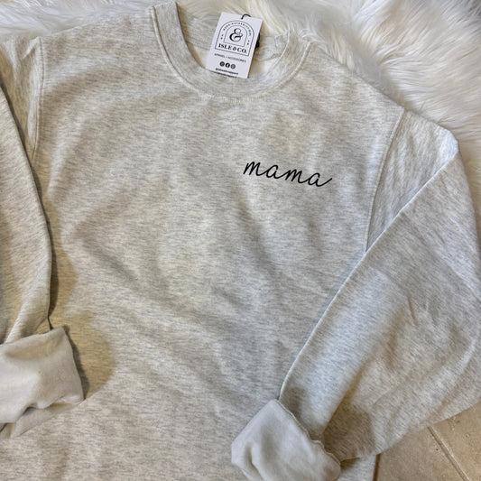 Gray sweatshirt with 'mama' embroidery on a light background